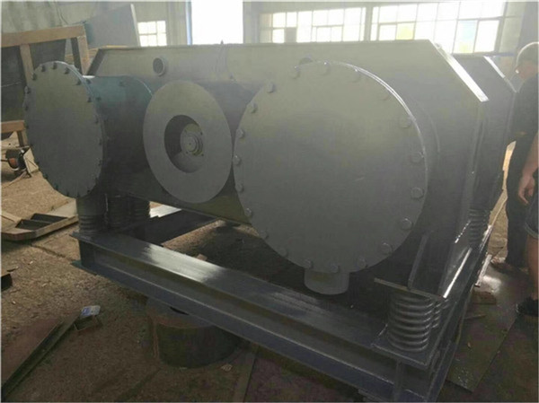 連續(xù)式雙頭振動磨的工作原理及應(yīng)用